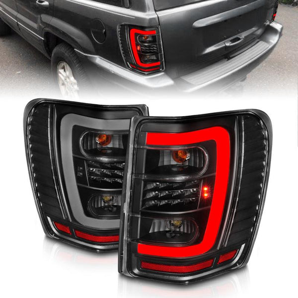 ANZO 1999-2004 Jeep Grand Cherokee LED Tail Lights w/ Light Bar Black  Housing Clear Lens